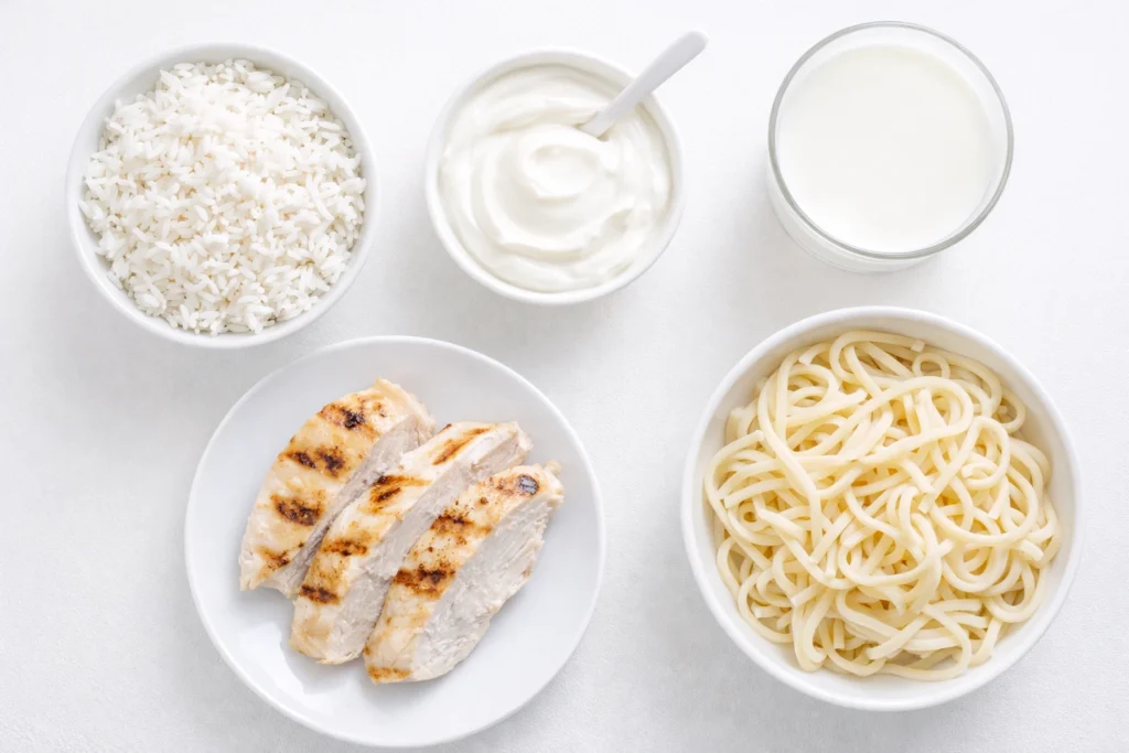 White diet foods like rice, grilled chicken, yogurt, milk and plain pasta recommended for teeth whitening after care to protect enamel and maintain results